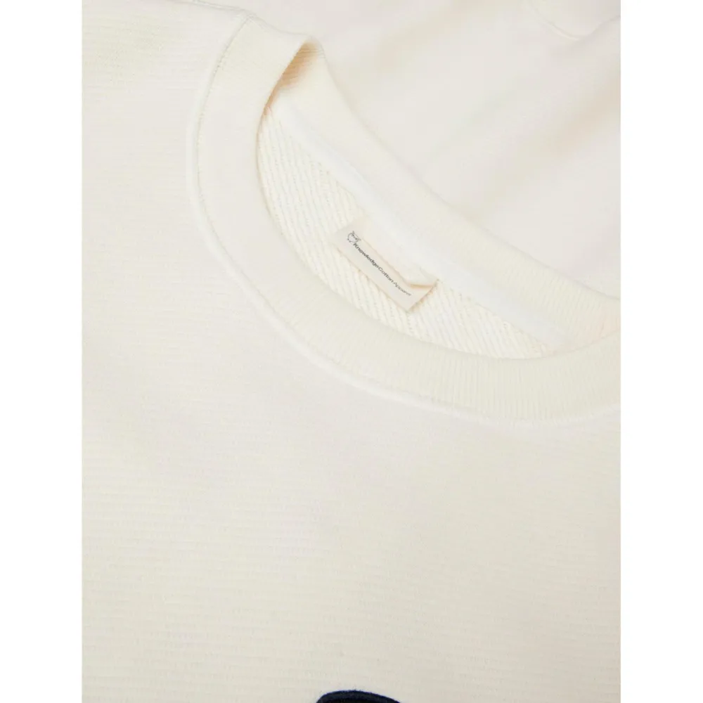 - ooe weater With Badge At Chet - Puover < KnowledgeCotton Apparel